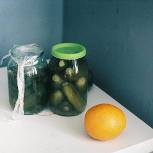 clear glass jar with green lid